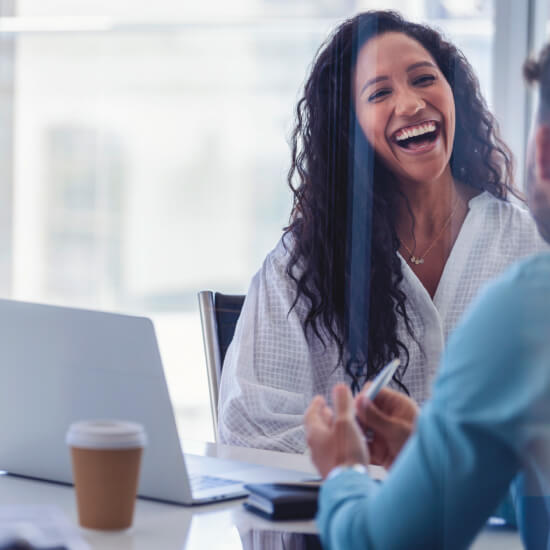 woman laughing in office