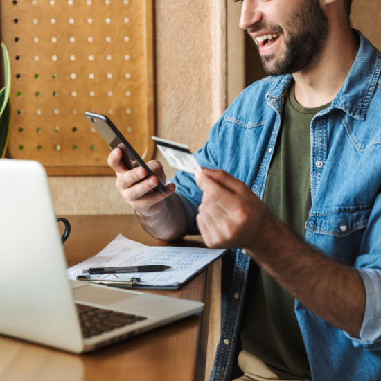 man with phone and credit card