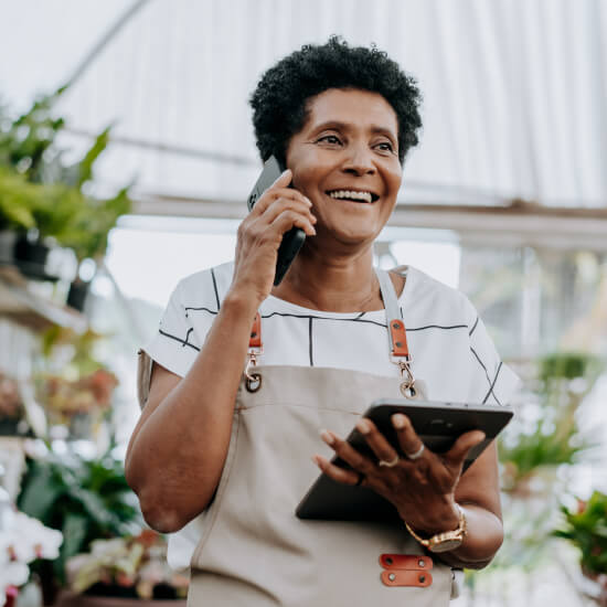 mature small businesswoman with tablet 