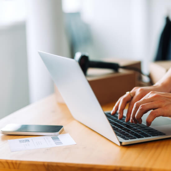 person typing on laptop