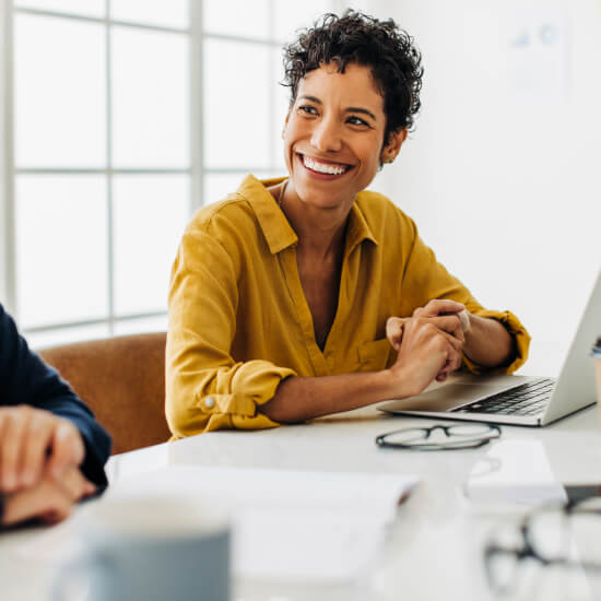 businesswoman smiling at office table