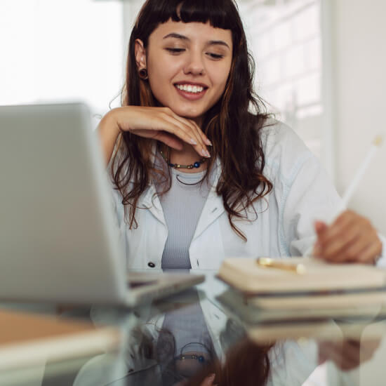 young woman writing in notebook